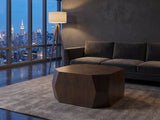 Urbino Acacia Veneer Faceted Coffee Table on a wool rug in front of a velvet sofa in a city penthouse at blue hour