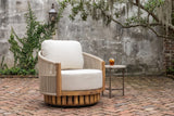 Ustica swivel chair on an old Savannah courtyard with a weathered grey wall, a trailing vine, a live oak with Spanish moss and a herringbone brick floor (side table not included)