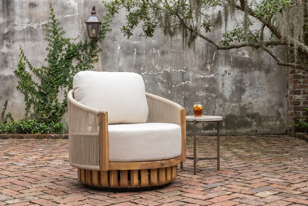 Ustica swivel chair on an old Savannah courtyard with a weathered grey wall, a trailing vine, a live oak with Spanish moss and a herringbone brick floor (side table not included)