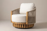 The Ustica acacia and rope swivel lounge chair with light beige cushions, three-quarter view on a light studio backdrop
