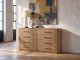 Valdagno 80-Inch Eucalyptus Veneer Dresser against a plaster wall in an industrial loft bedroom