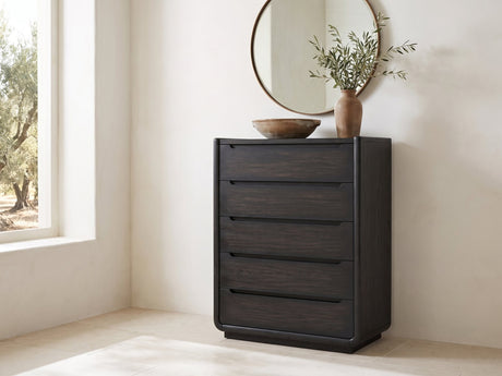 Valdobbiadene 40-Inch Burnished Black 5-Drawer Chest under a round bronze mirror in a villa bedroom