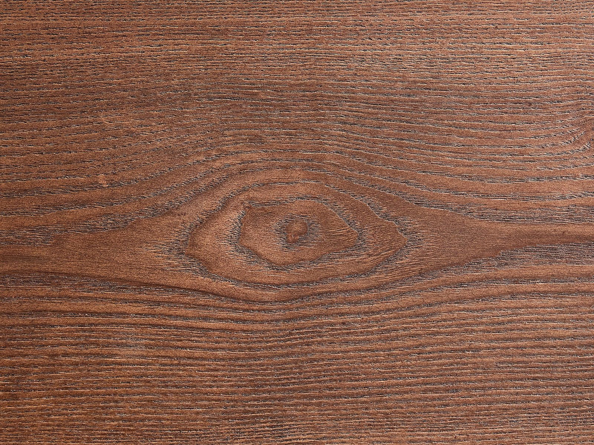 Close-up of the Valenza 50-Inch Freeform Walnut-Stained Veneer Nesting Coffee Tables, Set of 2: the walnut-stained ash veneer grain of the top