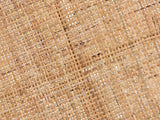 Close-up of the Valsinni Rattan Round Two-Tier Side Table: the woven rattan cane of the top