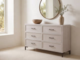 Venzone 64-Inch Cerused Oak 6-Drawer Dresser under a round bronze mirror in a villa bedroom