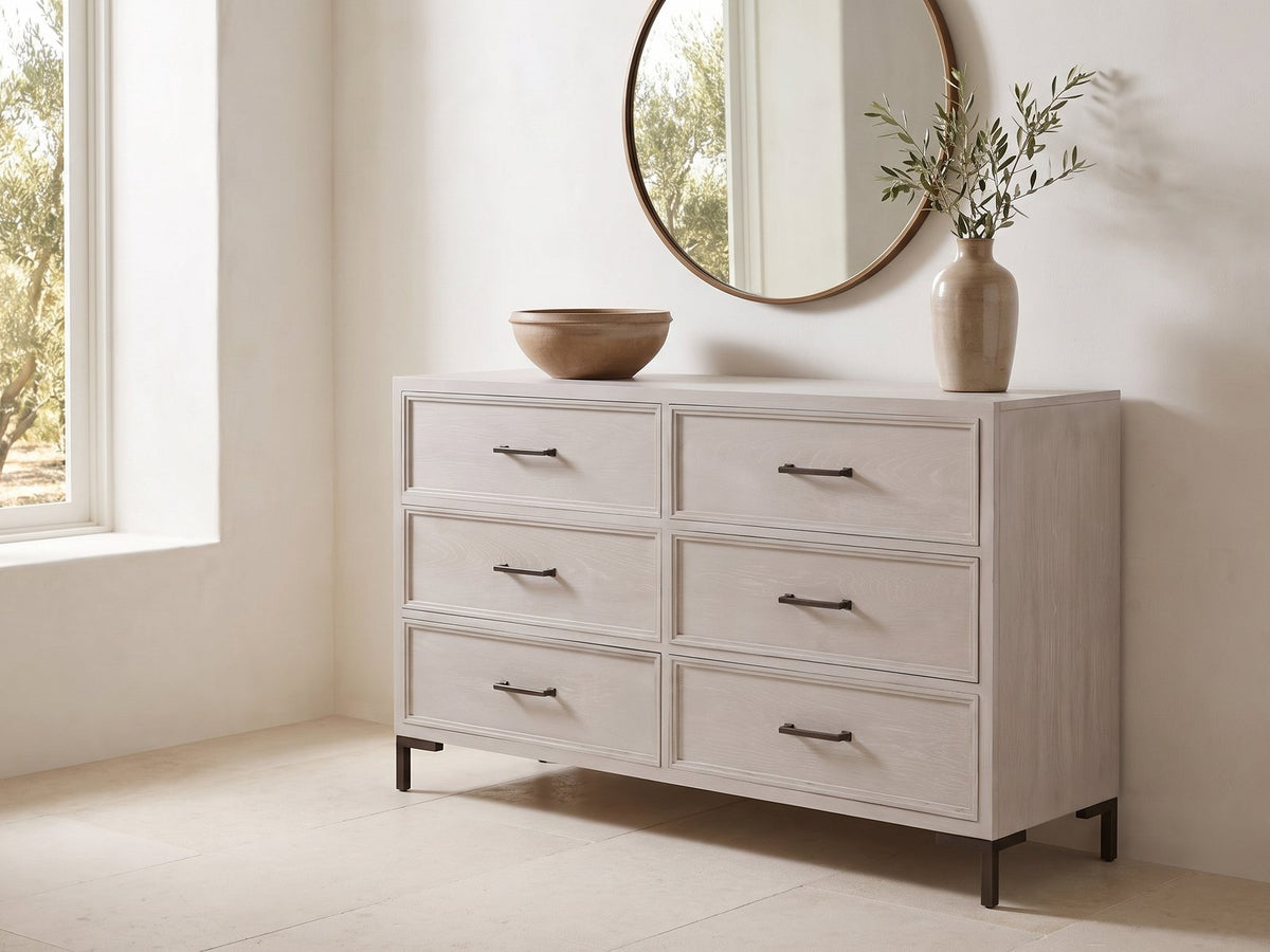 Venzone 64-Inch Cerused Oak 6-Drawer Dresser under a round bronze mirror in a villa bedroom