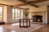 Verbicaro 60-Inch Round Reclaimed Pine Dining Table in an English country dining room