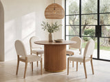 Veroli 47-Inch Round Fluted Pedestal Dining Set with 4 Chairs in a sunlit villa dining area with olive trees outside