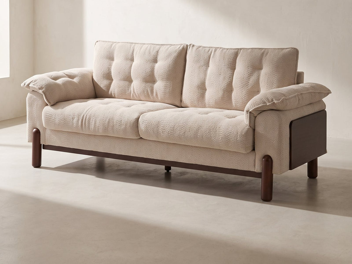 Verona Tufted Boucle Sofa in beige against a plaster wall in morning light