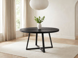 Verzino 47-Inch Round Black Acacia Sunburst Dining Table in a bright plaster dining room with linen curtains