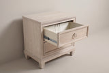 The top drawer of the Villacidro nightstand pulled open on a metal slide, showing the cord opening in the back panel