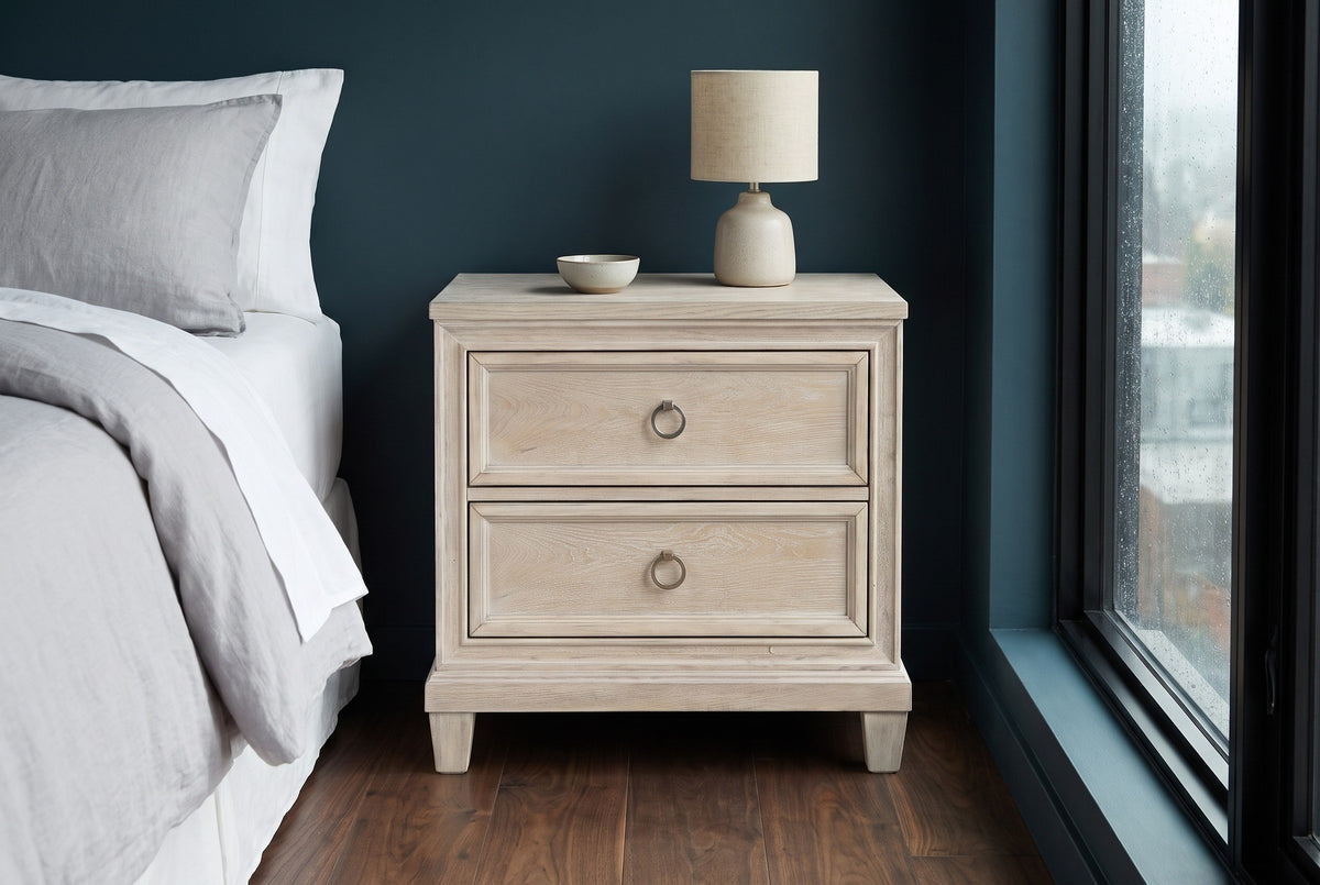 Villacidro washed oak nightstand with a lamp and bowl against a deep teal wall in a Seattle bedroom with a walnut floor