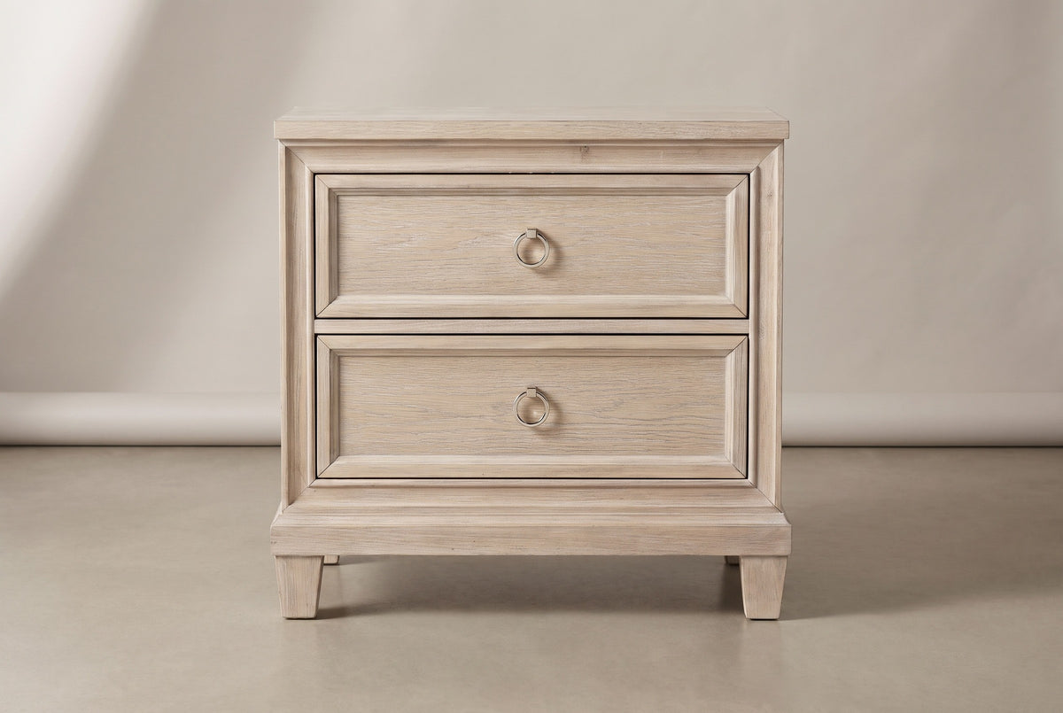 The Villacidro nightstand in pale washed oak, front view on a light studio backdrop