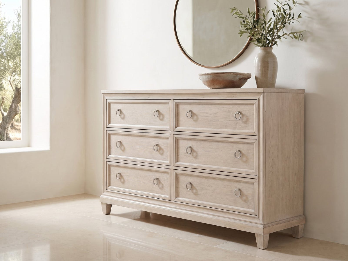 Vittorio 62-Inch Washed Oak 6-Drawer Dresser under a round bronze mirror in a villa bedroom