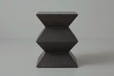 The Zafferana side table seen straight from one side: a zigzag outline with two narrow waists between a square top and base