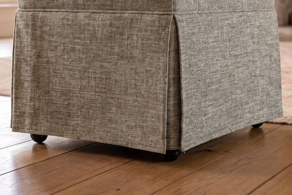Close-up of the Zagarise Hidden-Caster Skirted Upholstered Dining Chair: pleat