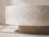 Close-up of the Zagarolo Faux Travertine Round Drum Coffee Table: the drum's overhang above its recessed round plinth