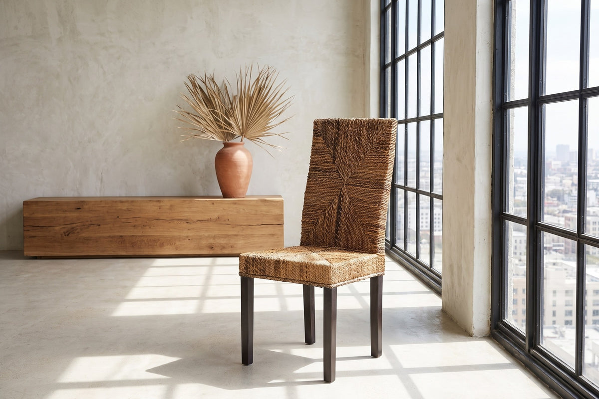 Zambrone Woven Natural Fiber Parsons Dining Chair in a city loft
